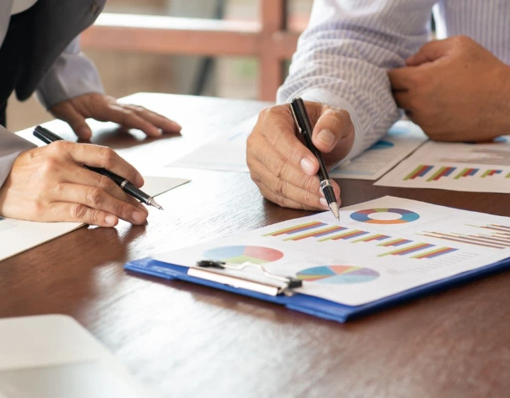 Investors reviewing financial reports to evaluate policy continuity, capex execution, and long-term earnings outlook